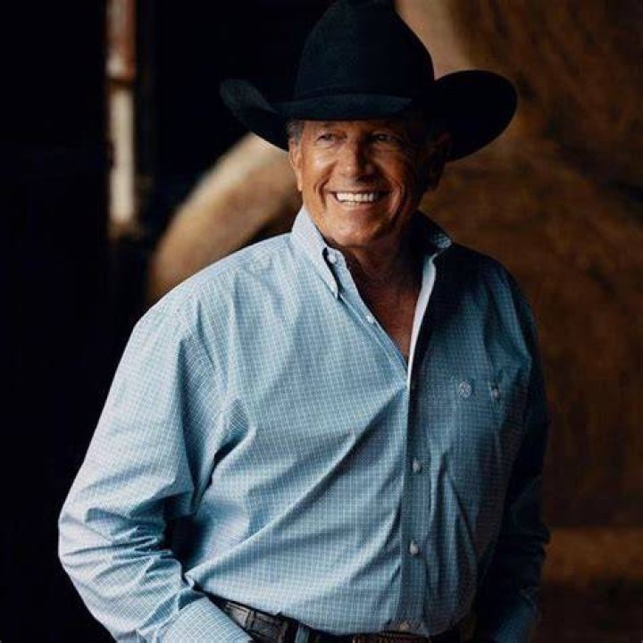 George Strait posing in front his Garia Golf.